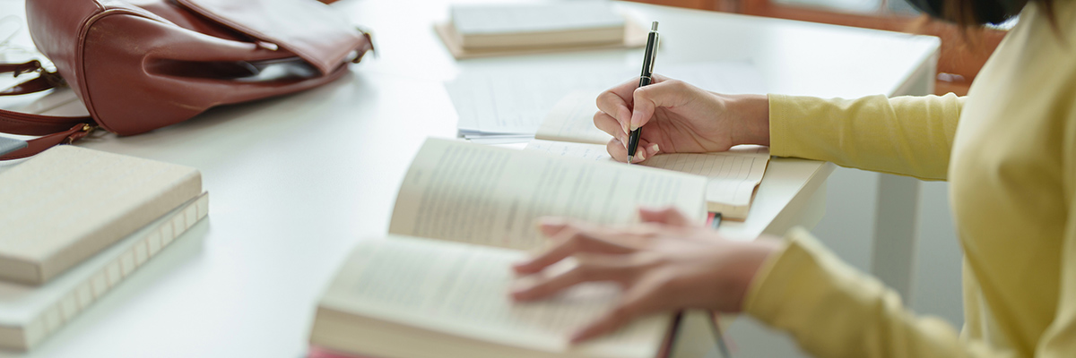 Person writing an academic paper